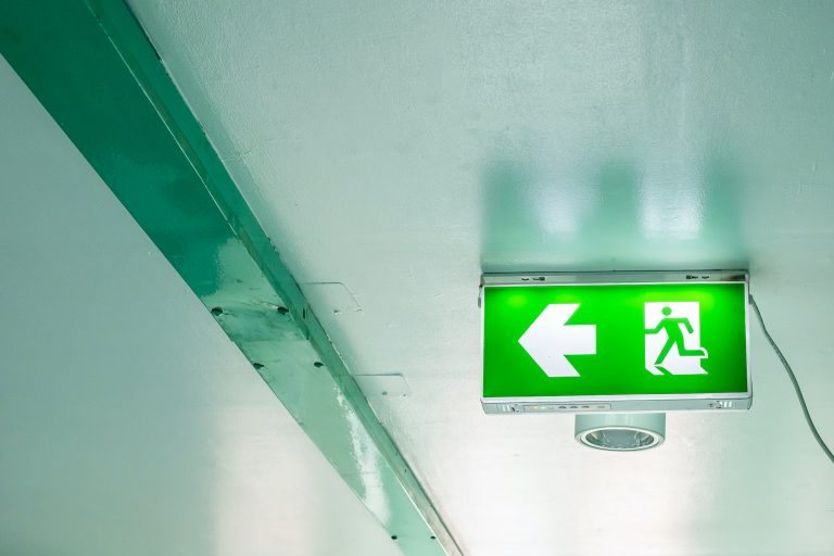 Emergency exit sign on interior building